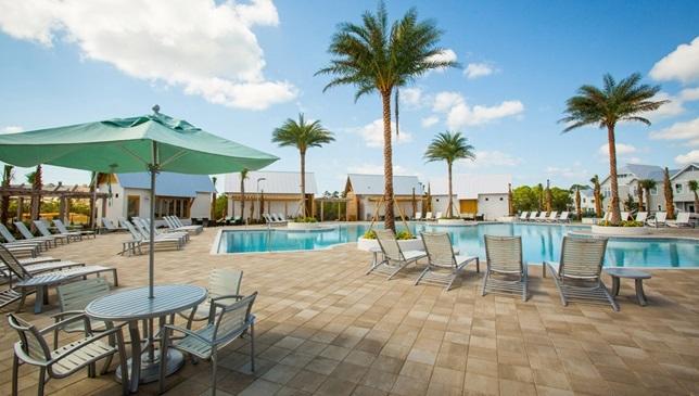 99 Pine Lands Loop Inlet Beach East, Unit A Inlet Beach, FL 32461 - Photo 25 of 30 a view of a patio with a table and chairs under an umbrella