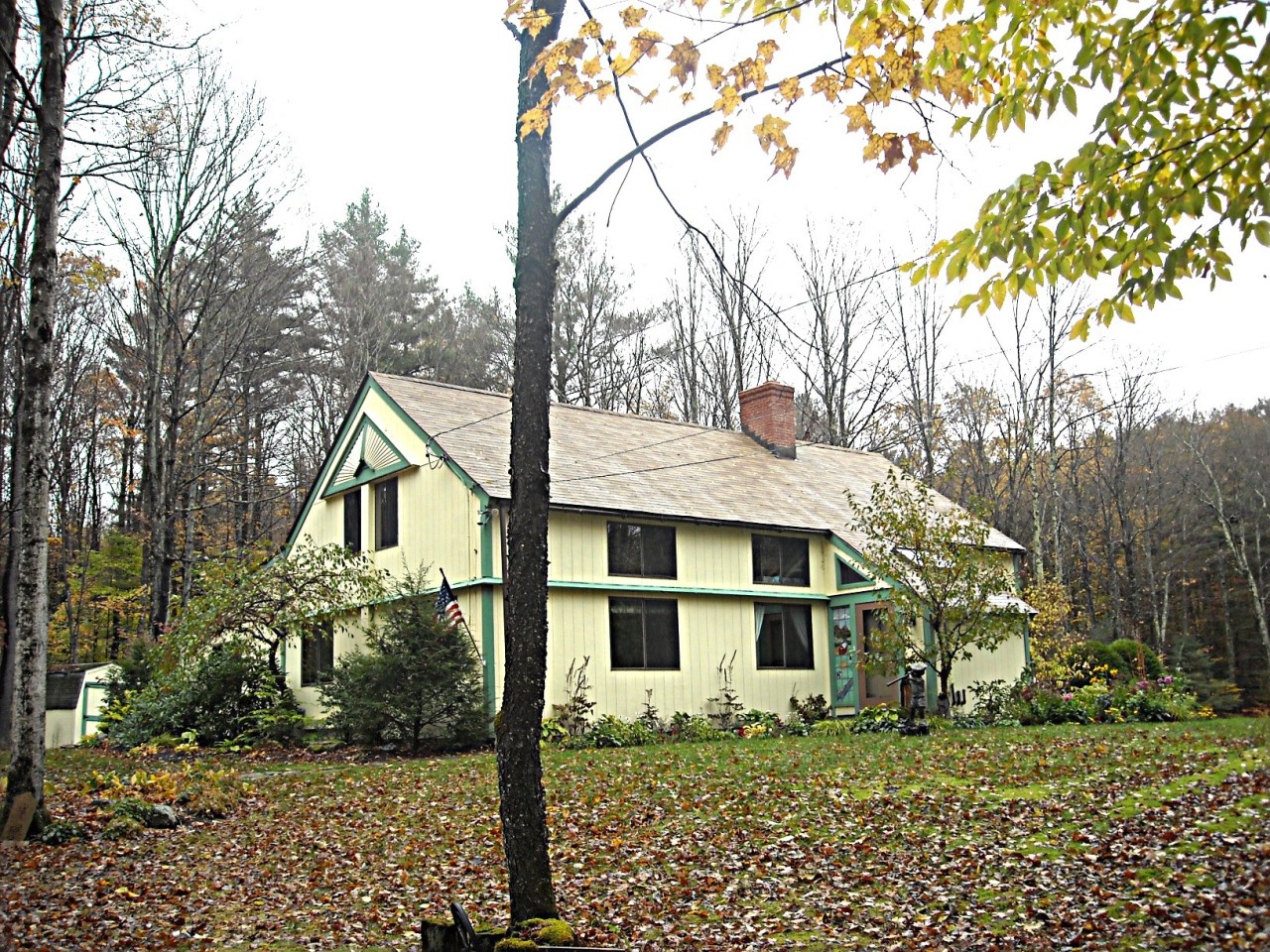 210 Hupi Road Monterey, MA 01245 - Photo 1 of 39 a front view of a house with a yard