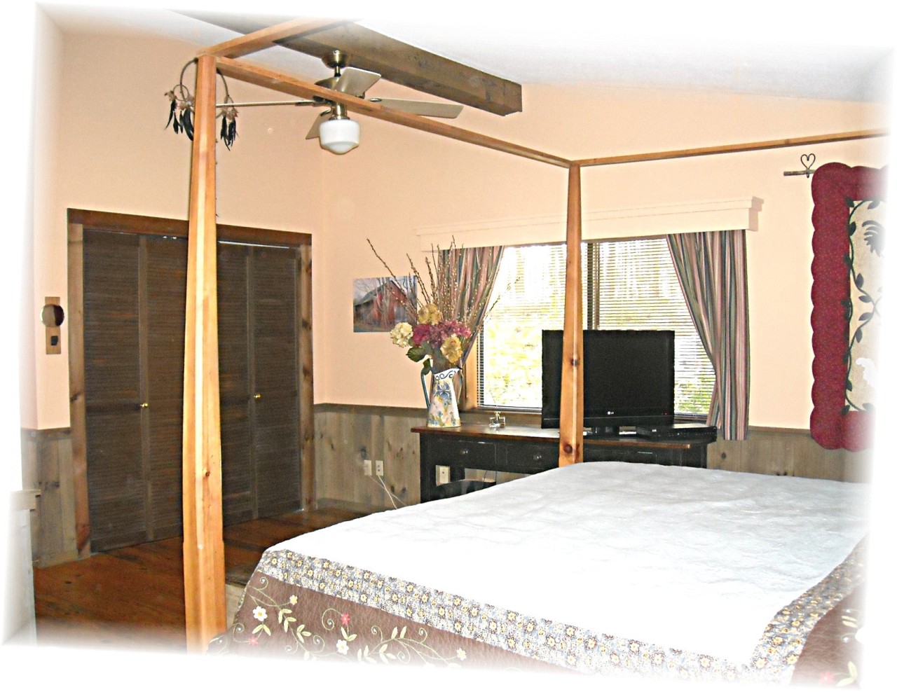 210 Hupi Road Monterey, MA 01245 - Photo 12 of 39 a bedroom with a bed and a flat tv screen on the dresser