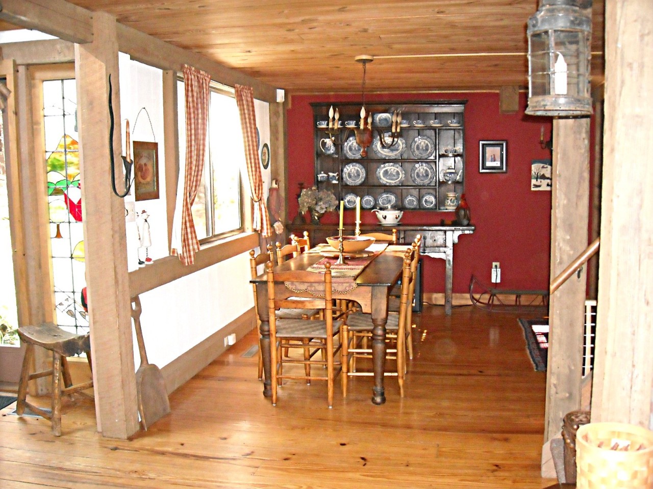 210 Hupi Road Monterey, MA 01245 - Photo 4 of 39 a dining room with furniture floor to ceiling windows and a potted plant