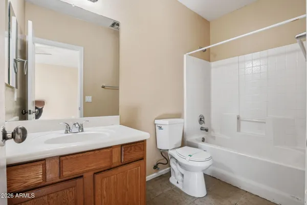 a bathroom with a sink vanity and a mirror