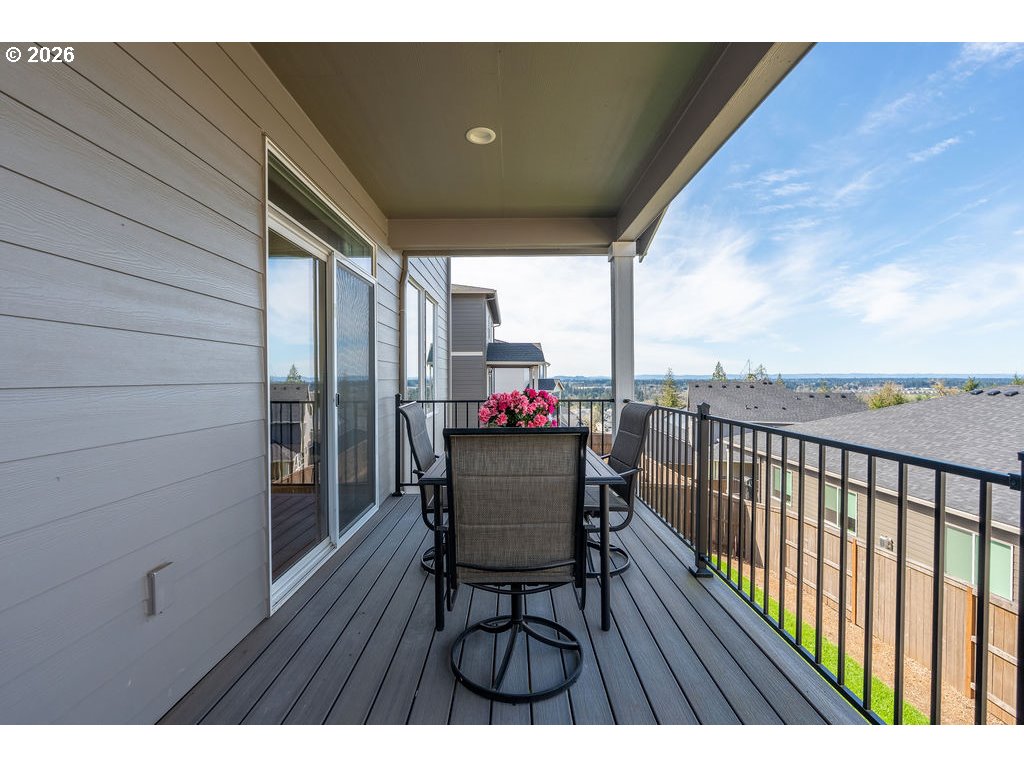 9149 North Hargrave Street Camas, WA 98607 - Photo 11 of 36 a balcony with wooden floor table and chairs