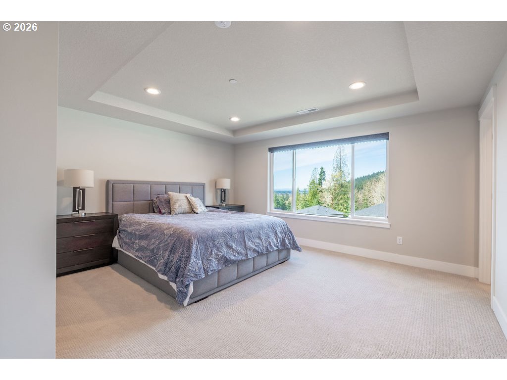 9149 North Hargrave Street Camas, WA 98607 - Photo 13 of 36 a spacious bedroom with a bed and a large window