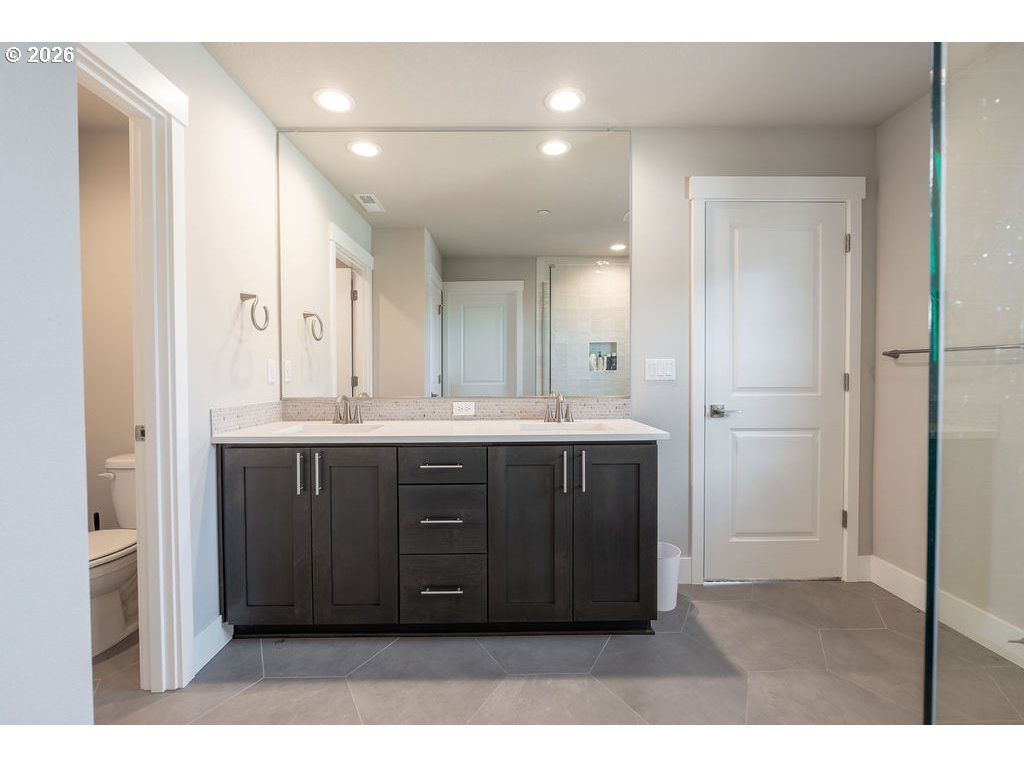 9149 North Hargrave Street Camas, WA 98607 - Photo 15 of 36 a bathroom with a sink vanity and a mirror