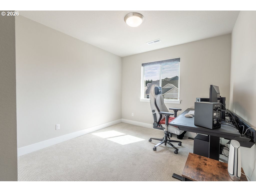 9149 North Hargrave Street Camas, WA 98607 - Photo 18 of 36 a view of a workspace with furniture and a window