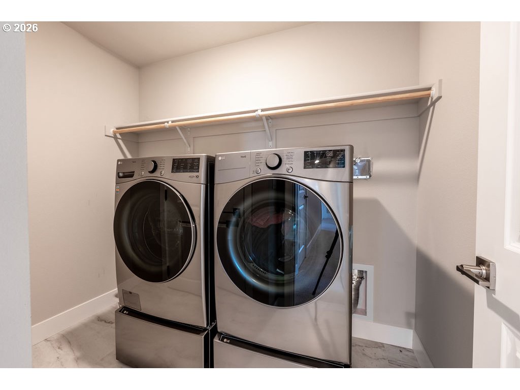 9149 North Hargrave Street Camas, WA 98607 - Photo 20 of 36 a view of a hallway with washer and dryer