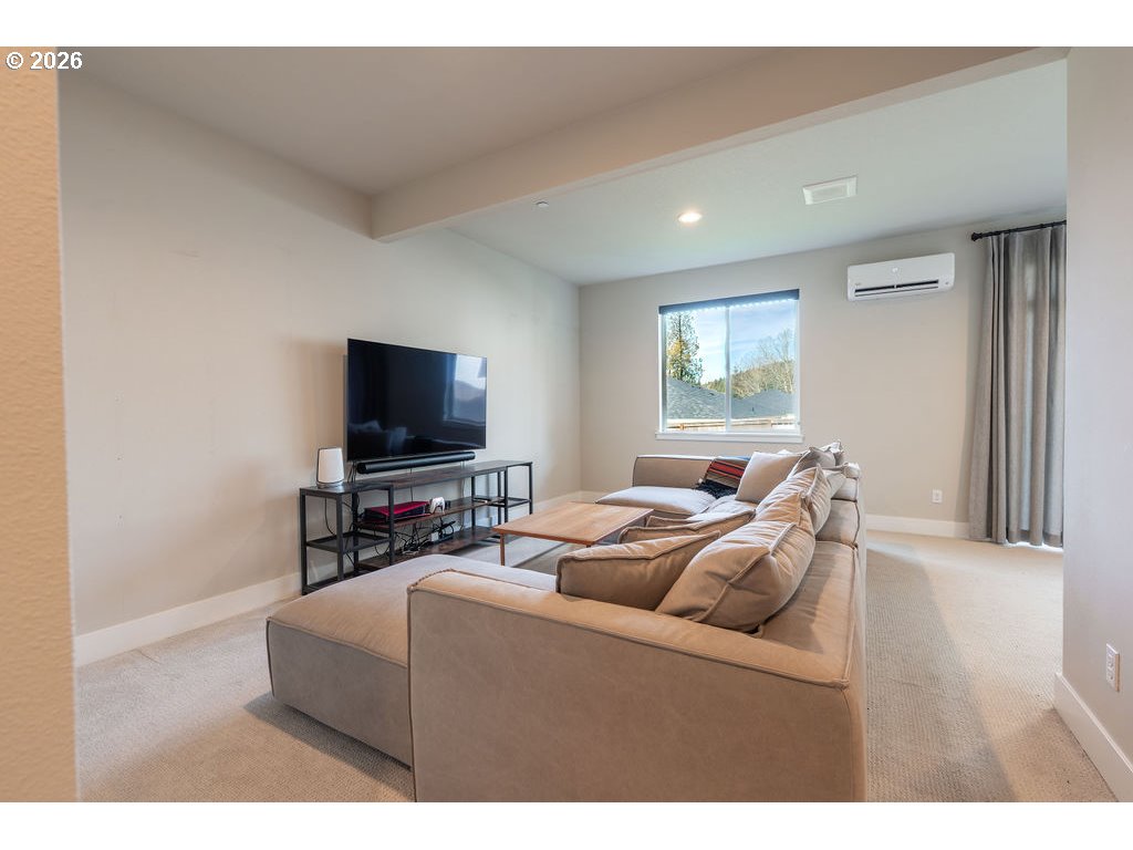 9149 North Hargrave Street Camas, WA 98607 - Photo 21 of 36 a living room with furniture and a flat screen tv