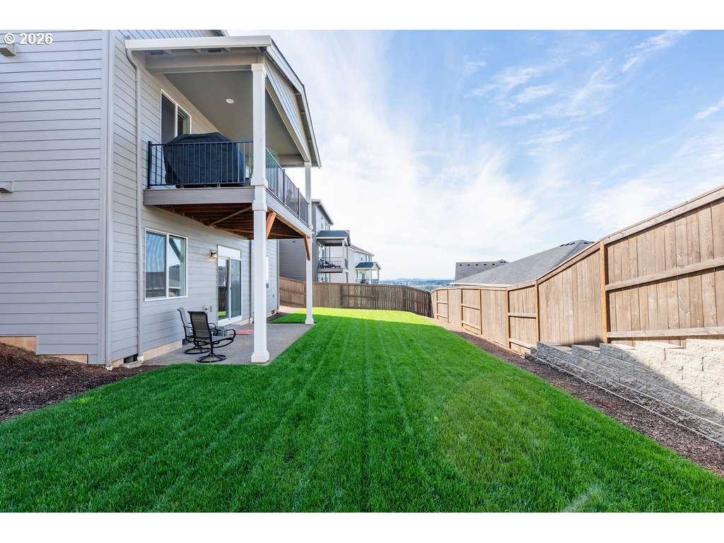 9149 North Hargrave Street Camas, WA 98607 - Photo 28 of 36 a view of a house with a yard and sitting area