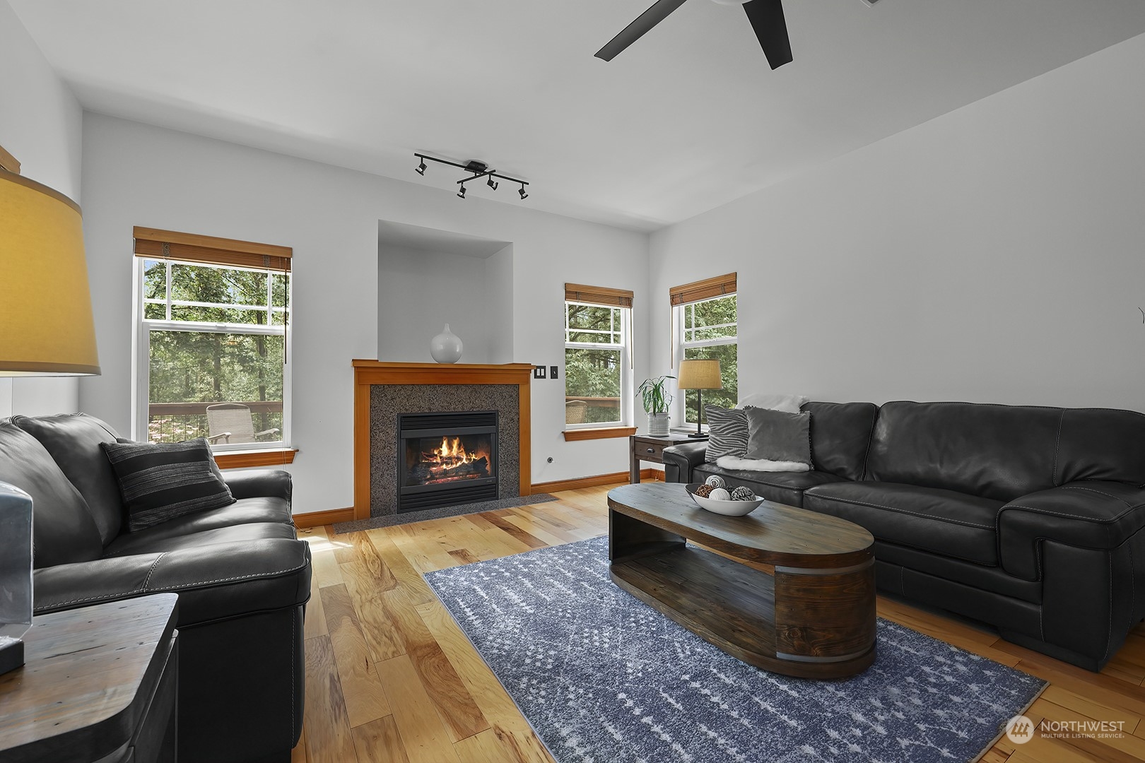18564 Rainier View Road Southeast Monroe, WA 98272 - Photo 11 of 34 a living room with furniture and a fireplace