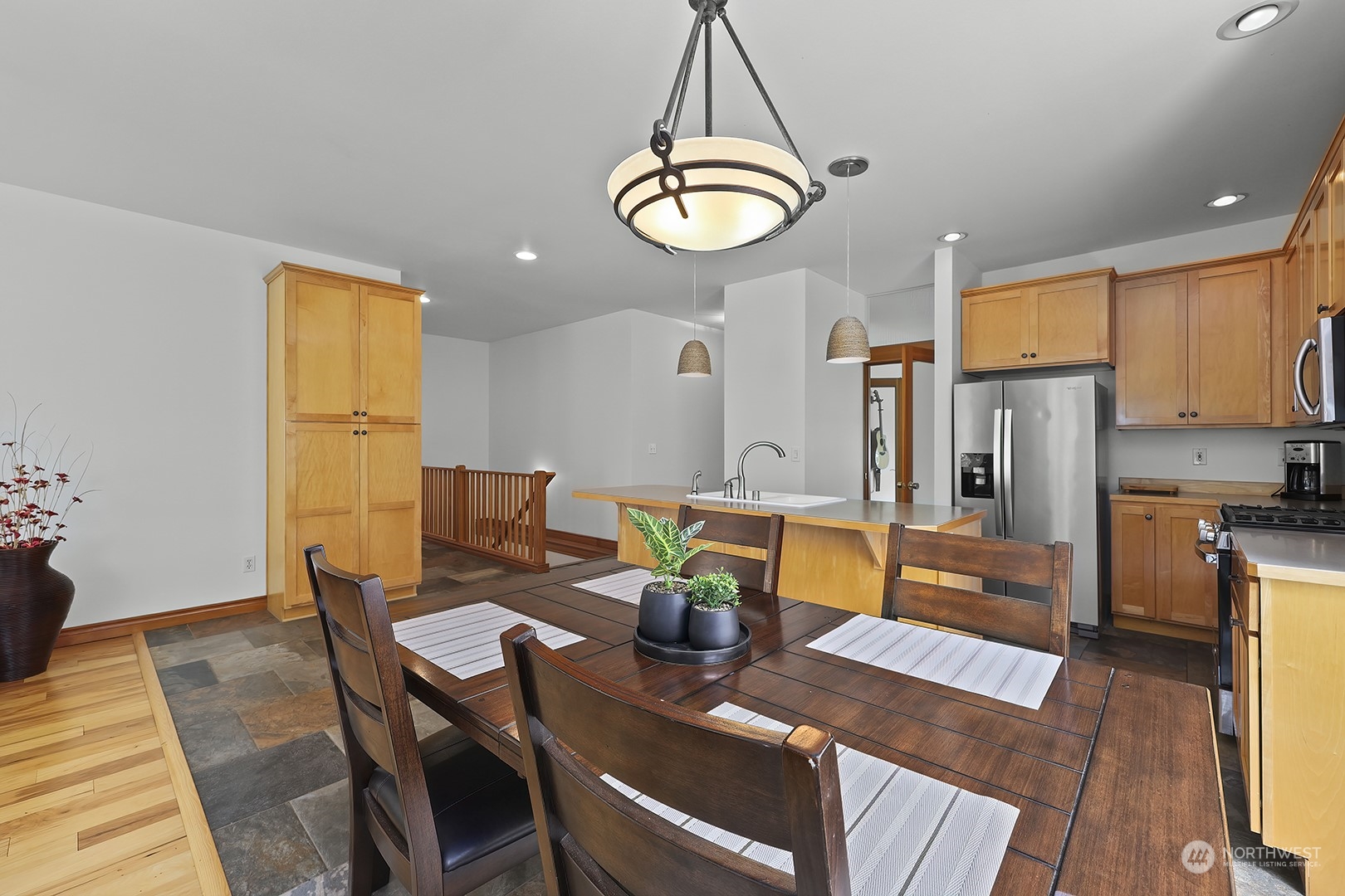 18564 Rainier View Road Southeast Monroe, WA 98272 - Photo 8 of 34 a view of a dining room with furniture window and wooden floor
