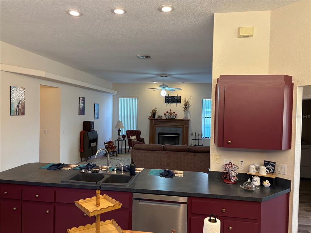 2810 Highview Bend Lakeland, FL 33812 - Photo 18 of 35 a kitchen with stainless steel appliances granite countertop a sink stove and cabinets
