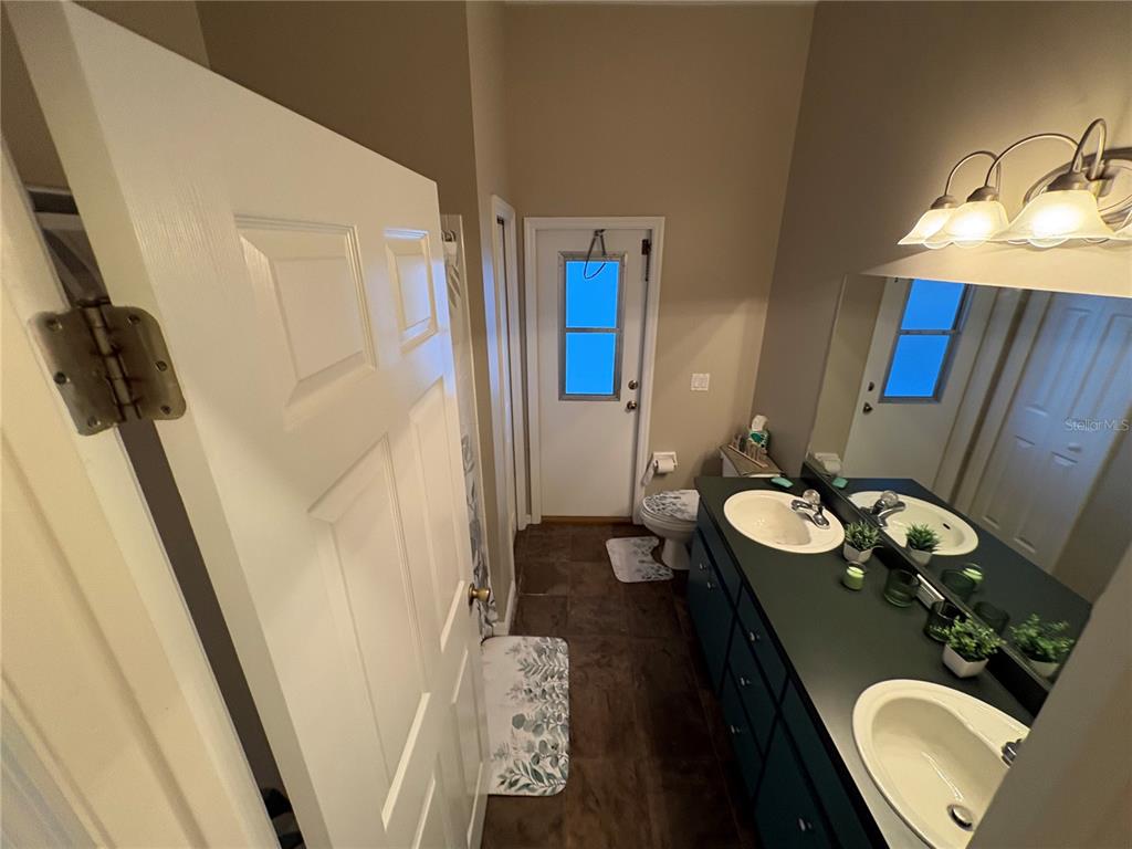2810 Highview Bend Lakeland, FL 33812 - Photo 23 of 35 a bathroom with a sink vanity granite and toilet