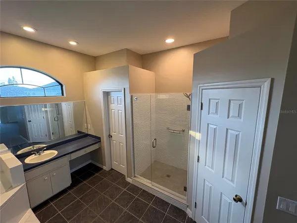 a view of an empty room with a floor to ceiling window