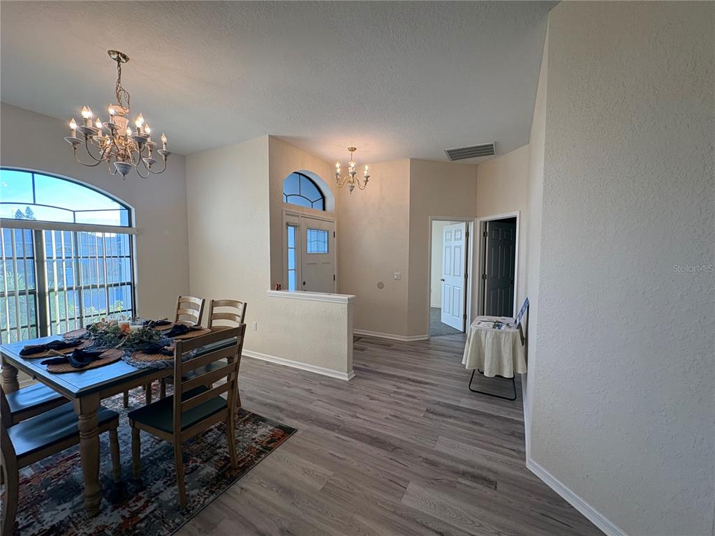2810 Highview Bend Lakeland, FL 33812 - Photo 8 of 35 a view of a dining room with furniture and chandelier