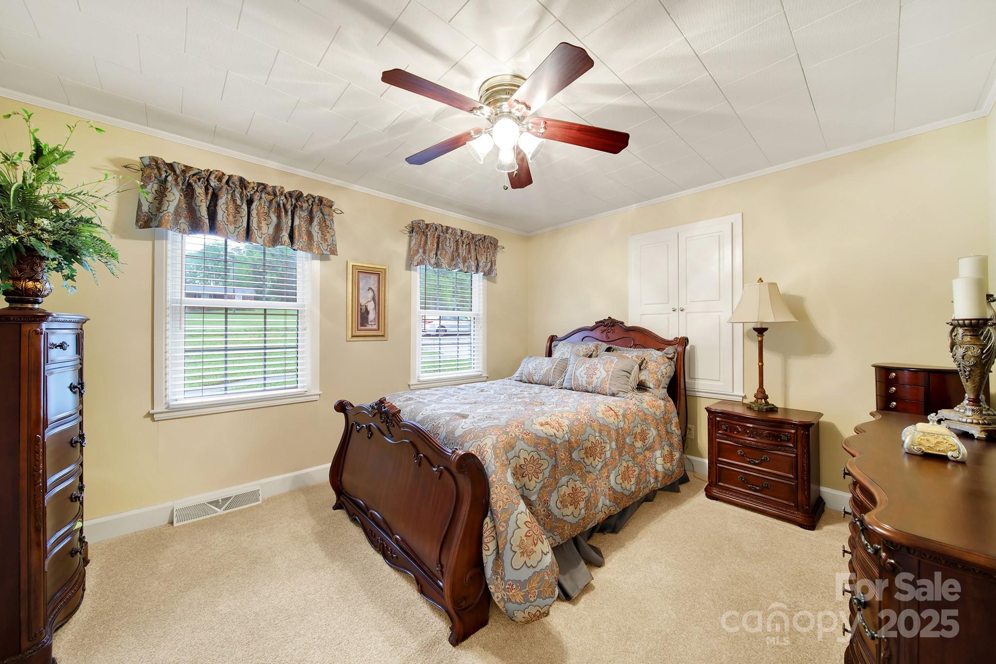 4462 Flat Creek Road Lancaster, SC 29720 - Photo 12 of 35 a bedroom with a bed and a large window with the outer view