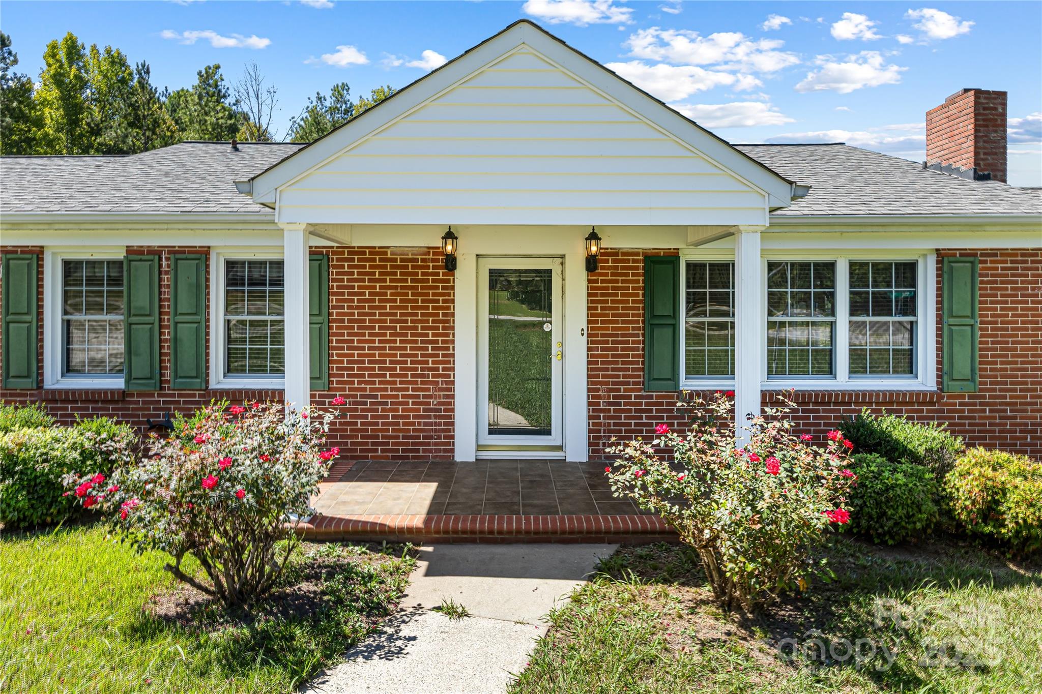 4462 Flat Creek Road Lancaster, SC 29720 - Photo 2 of 35 a front view of a house with a garden