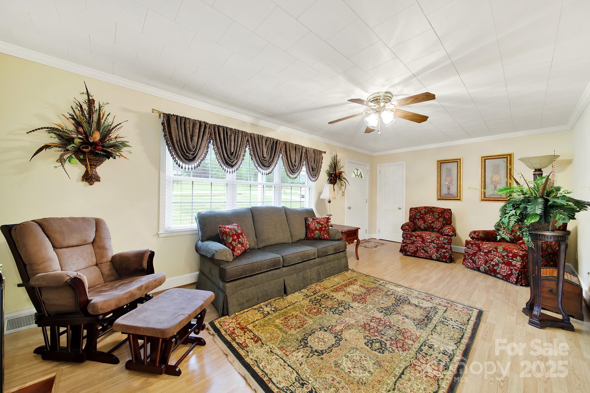 4462 Flat Creek Road Lancaster, SC 29720 - Photo 4 of 35 a living room with furniture and a chandelier