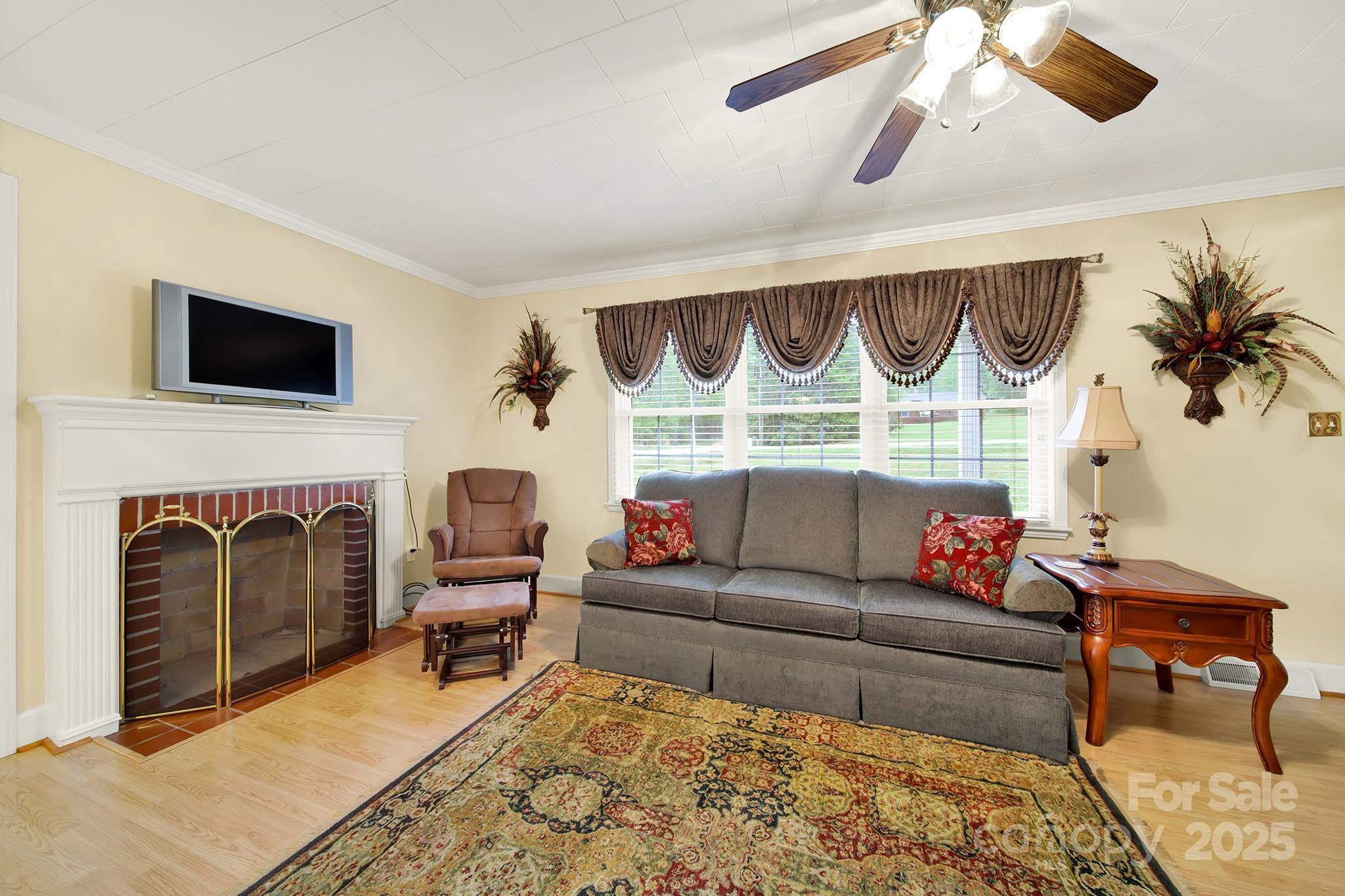 4462 Flat Creek Road Lancaster, SC 29720 - Photo 5 of 35 a living room with furniture and a fireplace