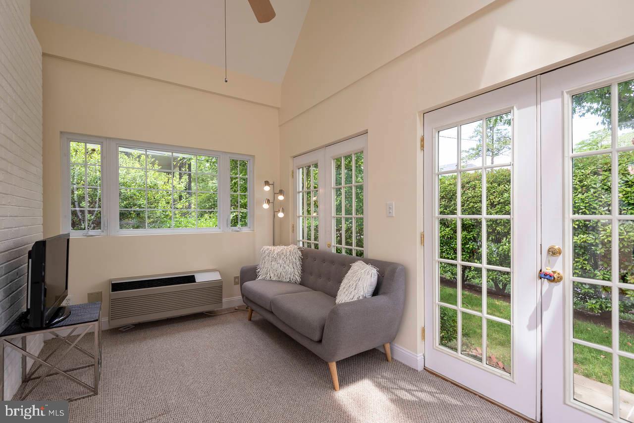 4330 37th Street Northwest Washington, DC 20008 - Photo 15 of 48 Sun room w/ cathedral ceiling, doors to side yard
