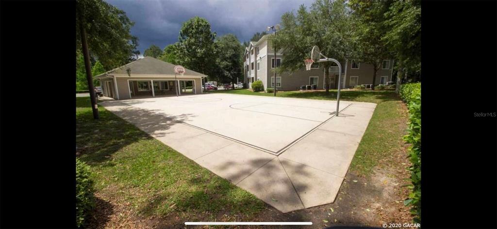 4000 Southwest 23rd Street, Unit 4103 #4 Gainesville, FL 32608 - Photo 14 of 17 a house with yard in front of it