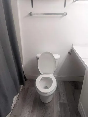 a bathroom with a toilet and a sink