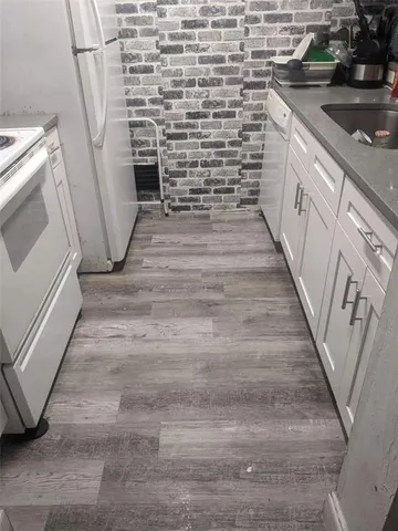 a bathroom with a sink and a stove