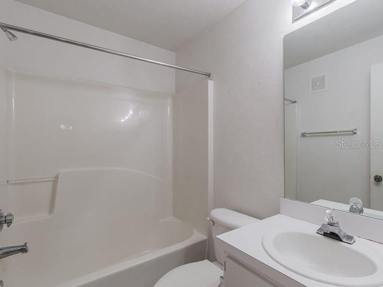 4000 Southwest 23rd Street, Unit 4103 #4 Gainesville, FL 32608 - Photo 9 of 17 a bathroom with a sink toilet and shower