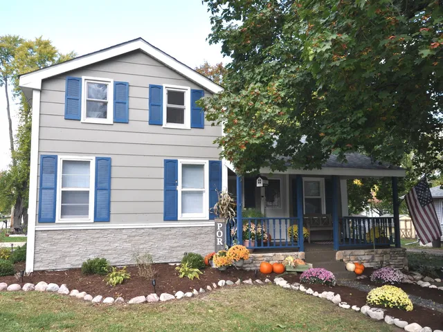 a front view of a house with yard