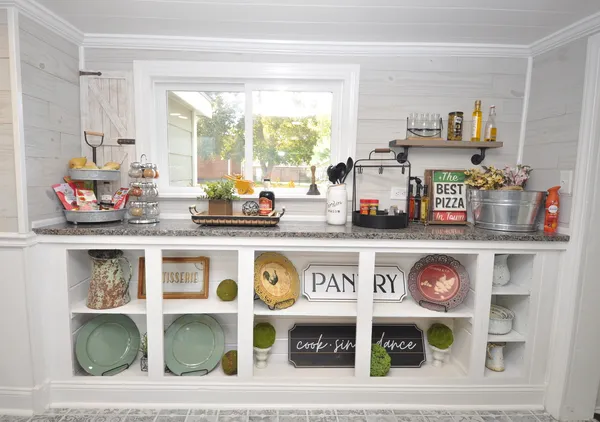 a kitchen with a stove and cabinets