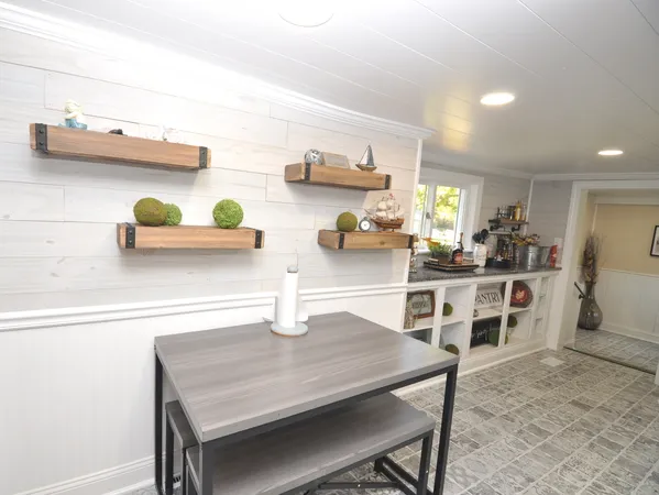 a kitchen with a table and chairs