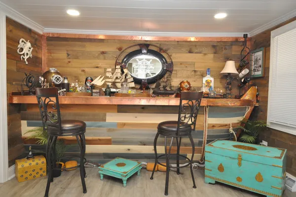 a living room with furniture and a clock