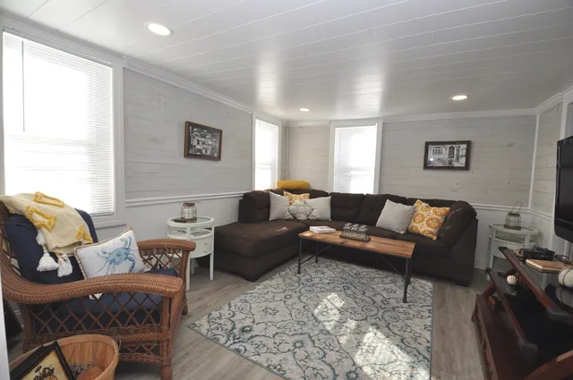 a living room with furniture window and a lamp
