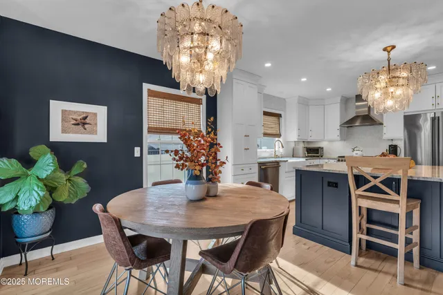 a bathroom with a sink and mirror with painted walls