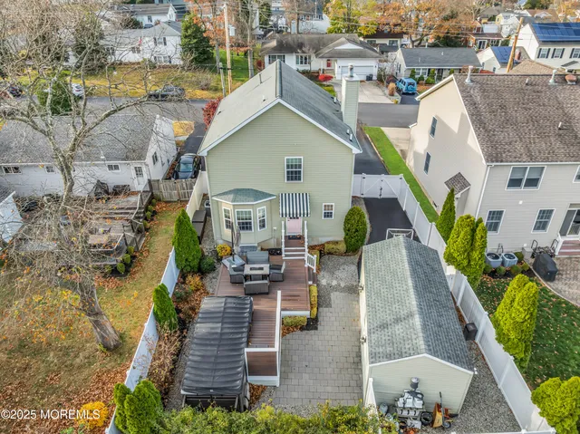 aerial view of a house with a yard