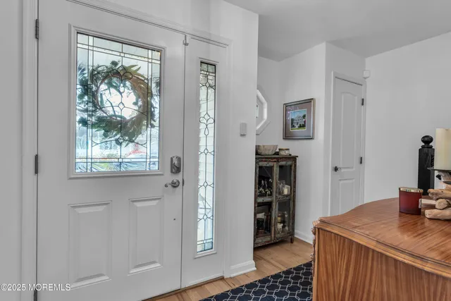 a view of a livingroom with furniture and window