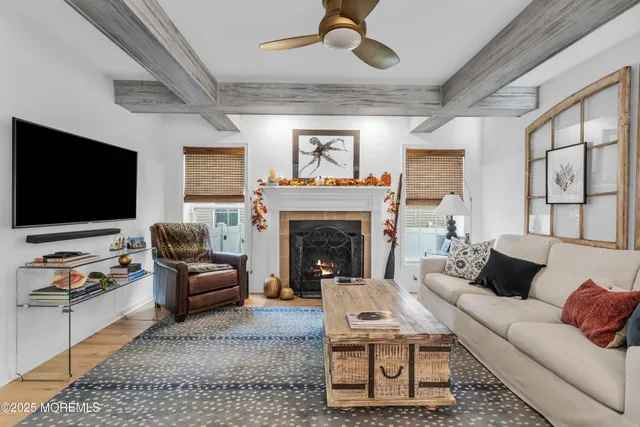 a kitchen with a table chairs sink and cabinets