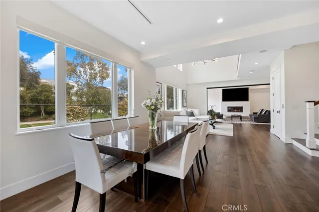 a kitchen with stainless steel appliances kitchen island granite countertop a sink a stove and a refrigerator