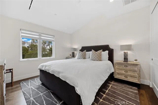 a living room with furniture and large windows