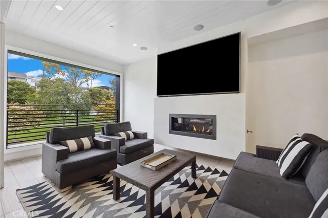 a view of a two chairs and table in a patio