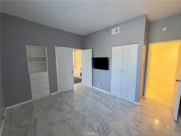 a view of kitchen with cabinets and wooden floor