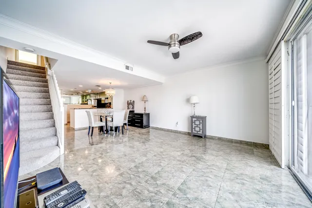 a view of a livingroom with furniture and a window