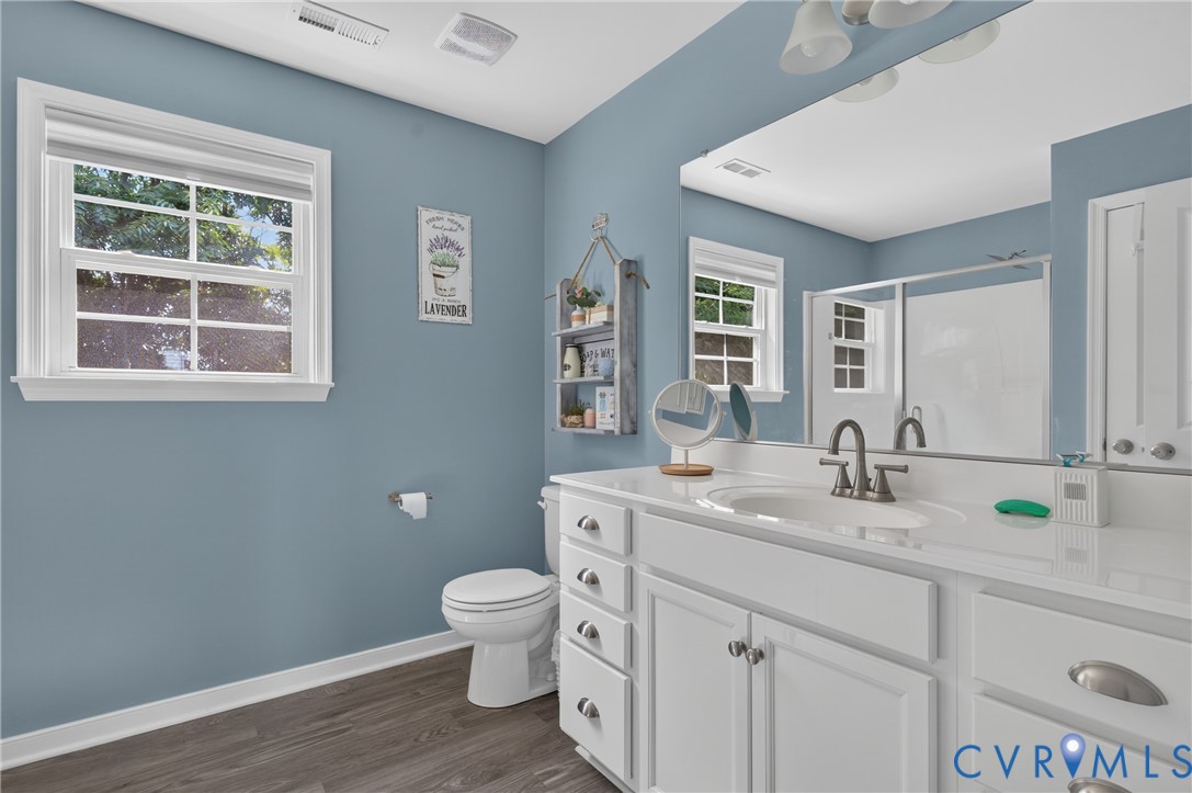 311 Cardinal Road Louisa, VA 23093 - Photo 23 of 39 Bathroom featuring a white vanity with an integrat