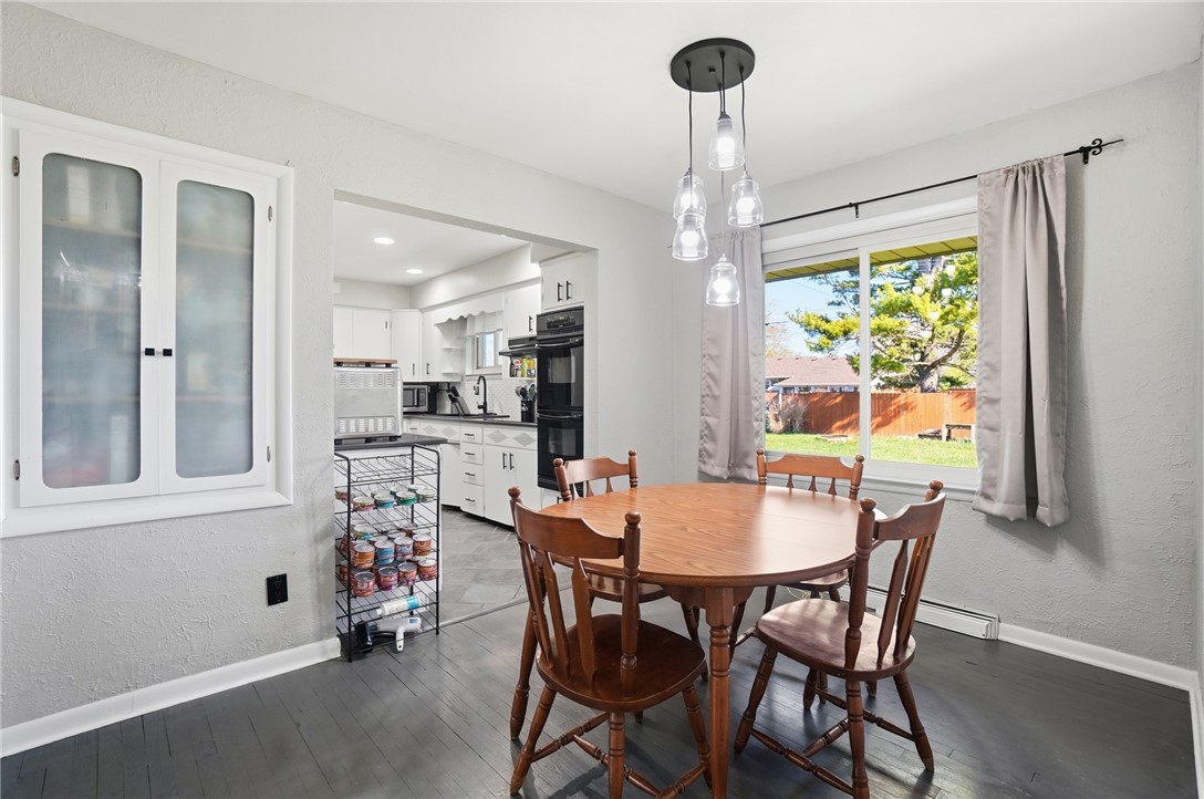 1325 Chelsea Road Troy, OH 45373 - Photo 12 of 42 This inviting dining area features ample natural light, creating a bright and airy atmosphere perfect for meals.
