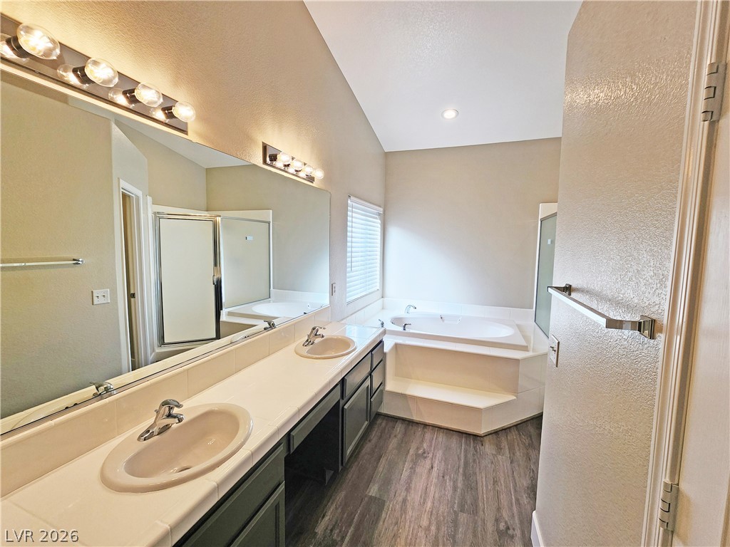 4591 Stoneham Street Pahrump, NV 89061 - Photo 26 of 42 Dual vanity with a spacious mirror provides ample space in this well-appointed primary bathroom.