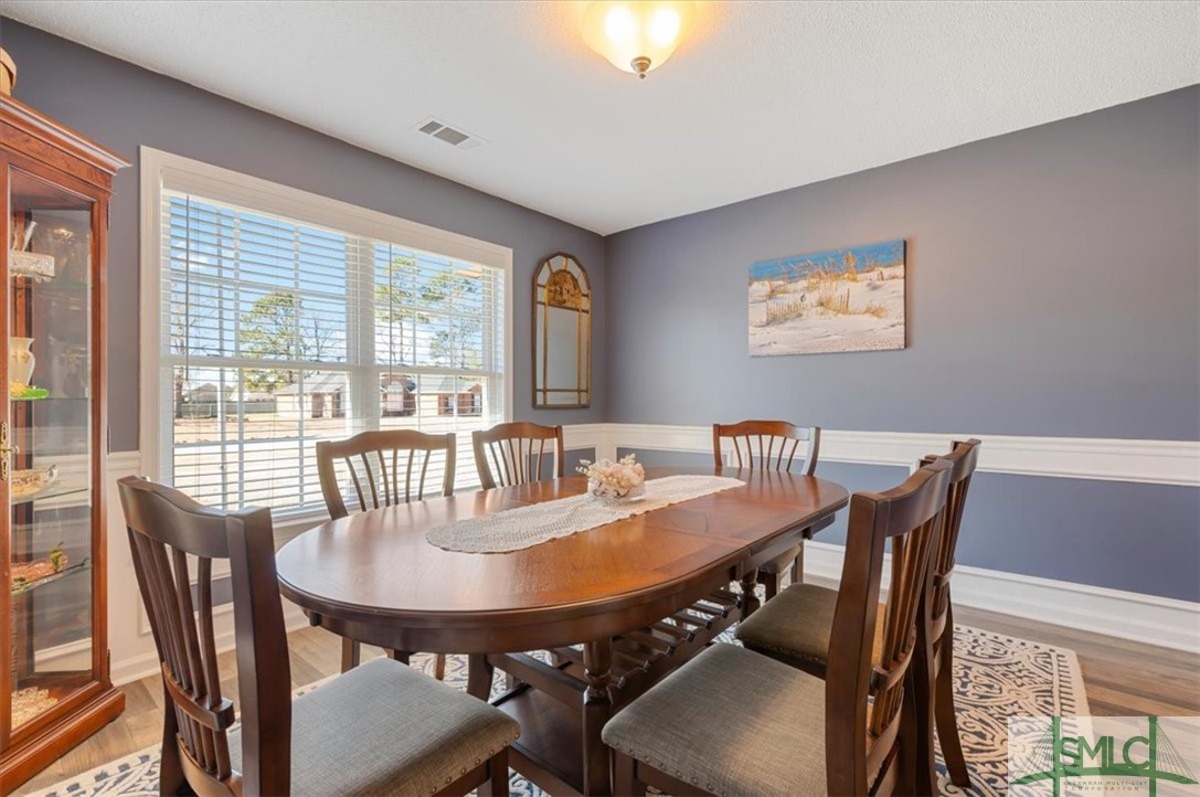 106 Tupelo Drive Rincon, GA 31326 - Photo 10 of 50 Formal dining room with large windows and wonderfu