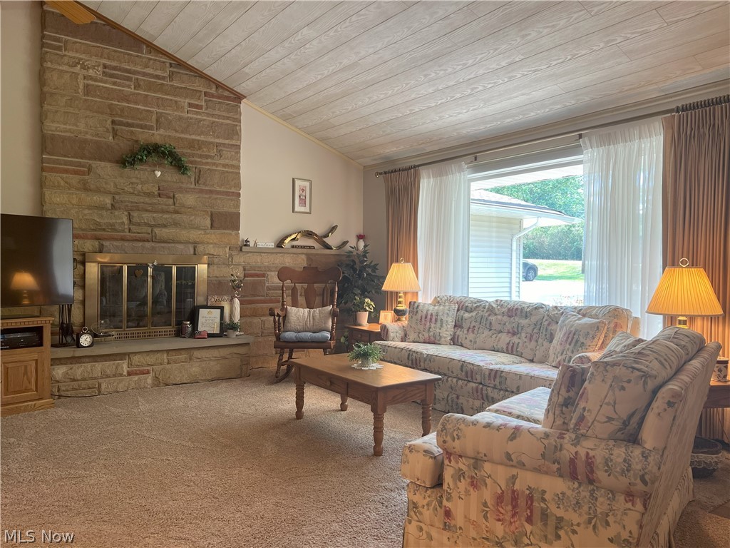 7325 Euclid Chardon Road Willoughby, OH 44094 - Photo 6 of 24 Living room with vaulted ceiling, carpet, a fireplace, and wood ceiling