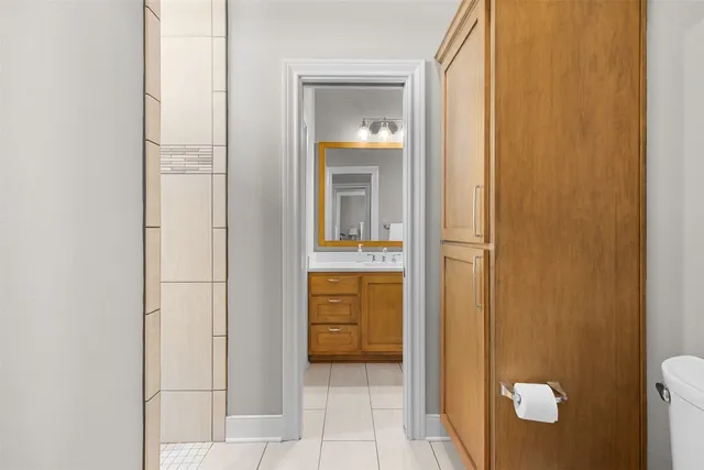 a view of a bathroom from a corridor