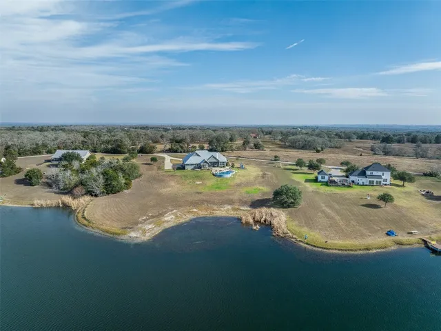 a view of a lake with tall buildings