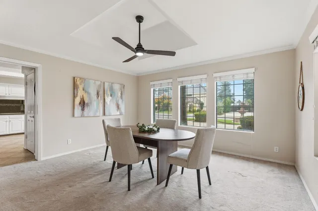 a living room with furniture kitchen view and a dining table