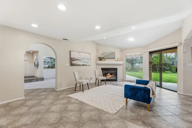a view of a dining room and livingroom with furniture
